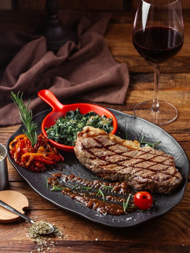 front-view-fried-meat-with-greens-inside-dark-plate-brown-wooden-desk-meal-food-dinner_140725-26134