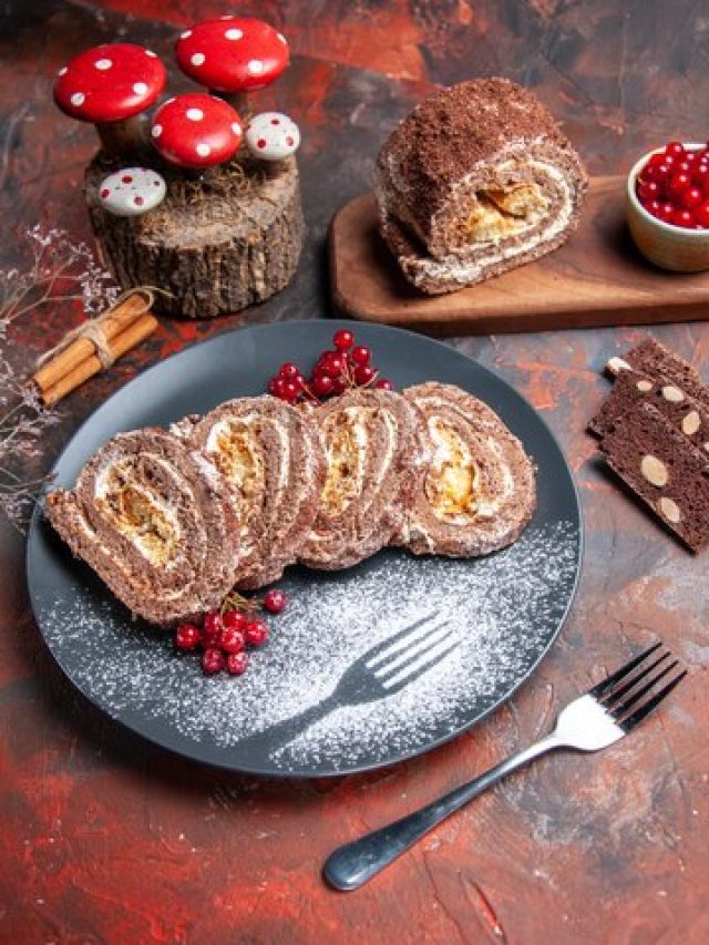 front-view-yummy-biscuit-rolls-inside-plate-dark-surface_140725-75037